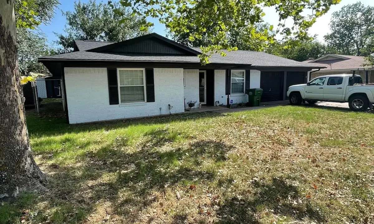 Professional roofing crew working on a residential roof in Everett